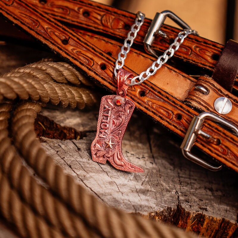 A custom pendant necklace with personalized name in the shape of a boot
